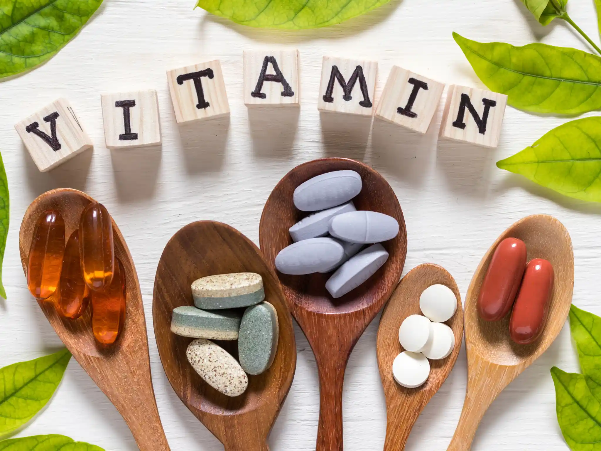 Cucchiaia con itnegratori vitamina B6 per lo sport
